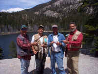 Brown, Pat, Stan & Mike show a nice stringer of Sierra Trout